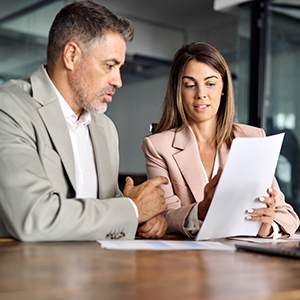 Two professionals reviewing documents, related to a South Carolina estate plan review with a lawyer.